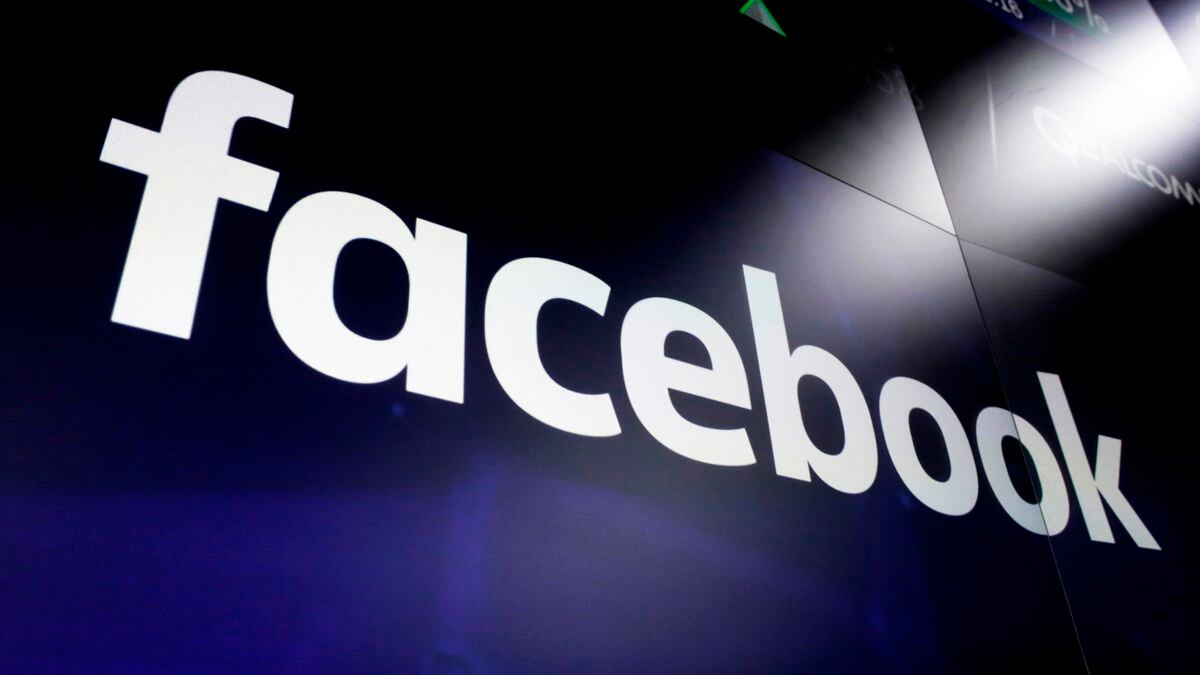 FILE - This March 29, 2018, file photo shows the Facebook logo on screens at the Nasdaq...